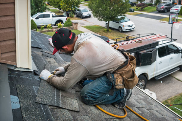 Professional Roofing technician working in North Pembroke, MA